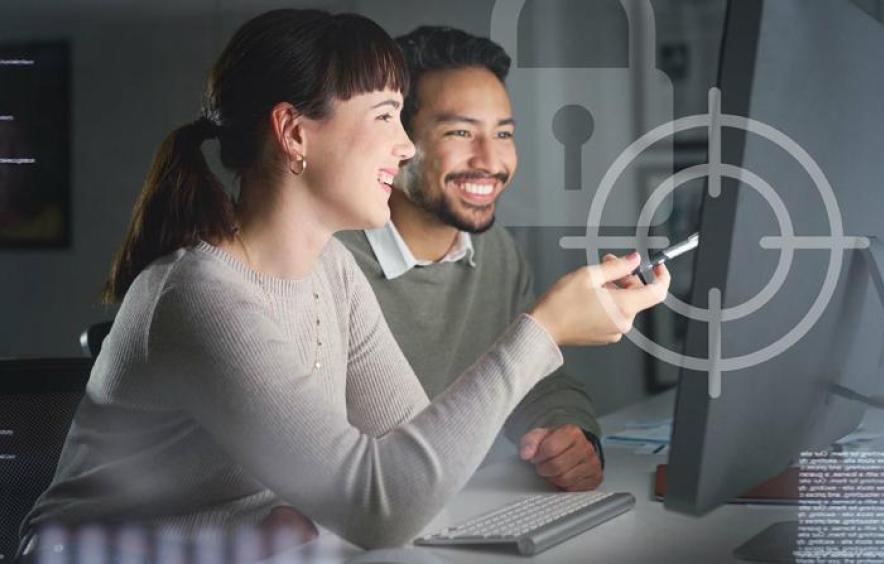 Two people looking at a computer screen