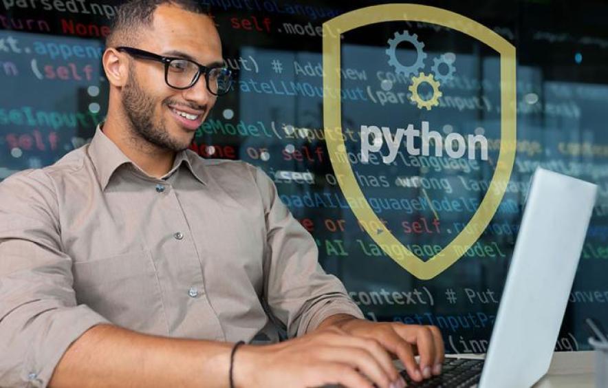 man looking at a computer with a python symbol in the background
