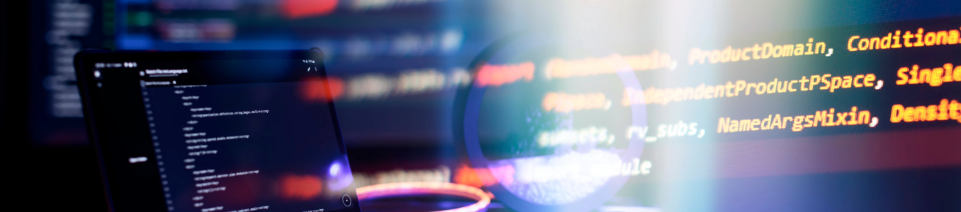 Computer screens displaying code.